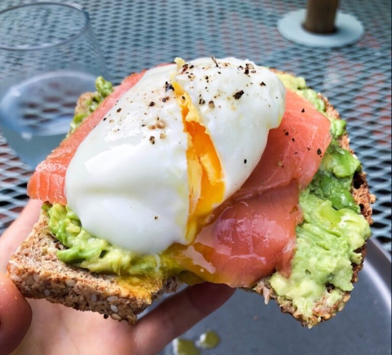 Smoked Salmon and egg with avocado on sprouted grain toast.
